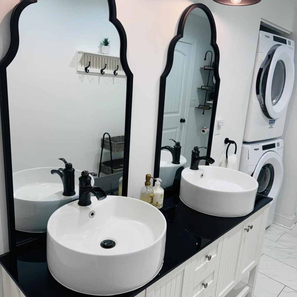 Immaculate bathroom with gleaming vessel sinks, streak-free mirrors, sanitized fixtures, and pristine laundry area showcasing expert bathroom cleaning services in Charlotte and Raleigh North Carolina