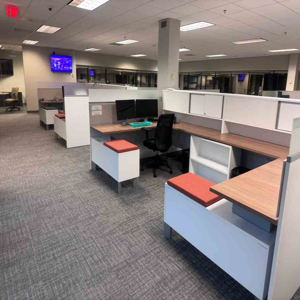 Impeccably preserved office workstations with rejuvenated textile flooring, germ-free desktop surfaces, revitalized chair upholstery, and pristine partition dividers illustrating comprehensive workplace hygiene solutions across Charlotte and Raleigh NC